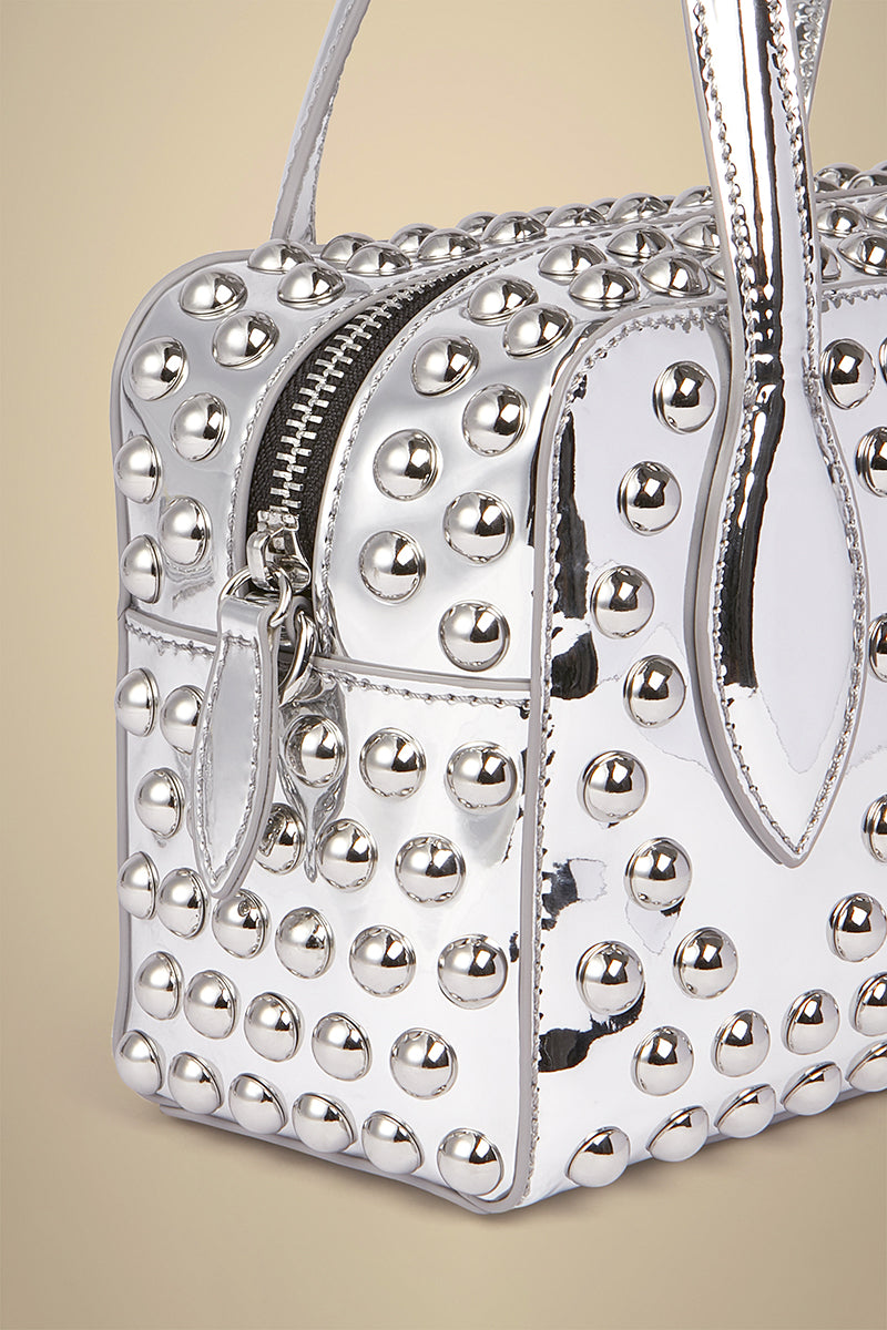 Liviana Conti bolso mini plata tachas